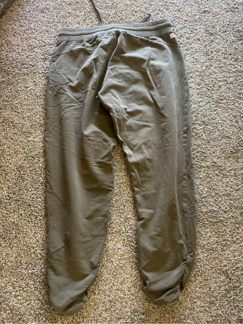 Pact womens Olive Jogger Sweatpants does have a hole